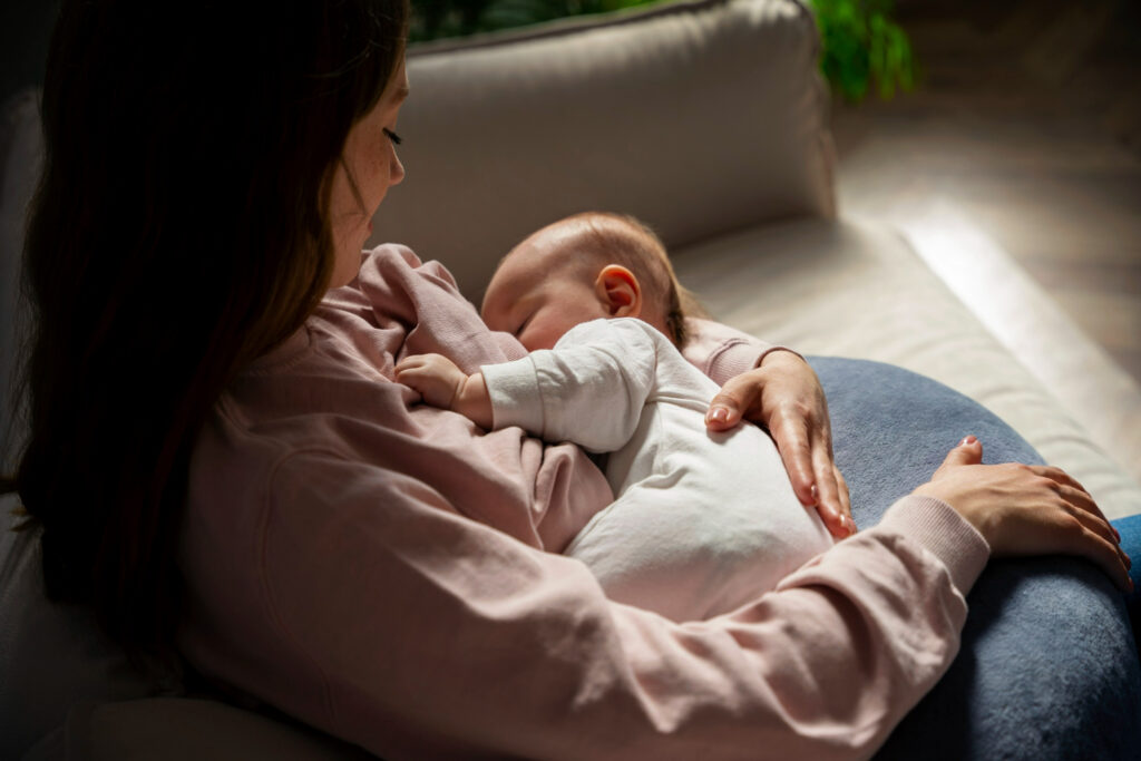 Close-up of a peaceful new born baby sleeping on a soft blanket