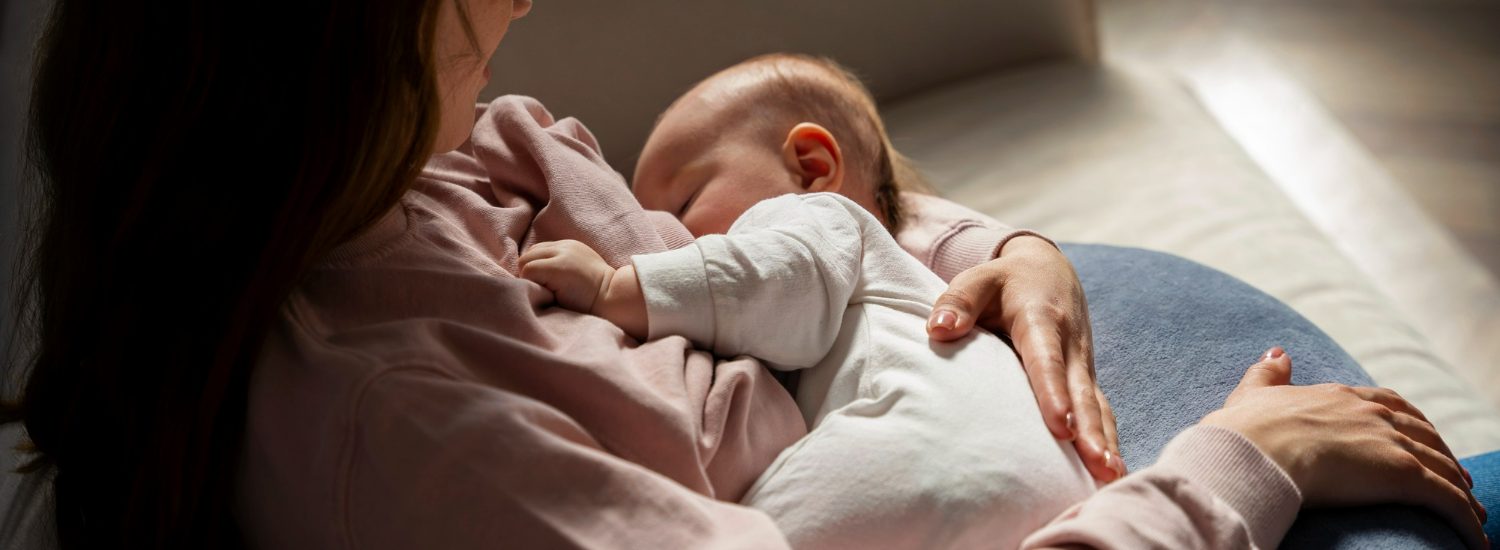 Close-up of a peaceful new born baby sleeping on a soft blanket